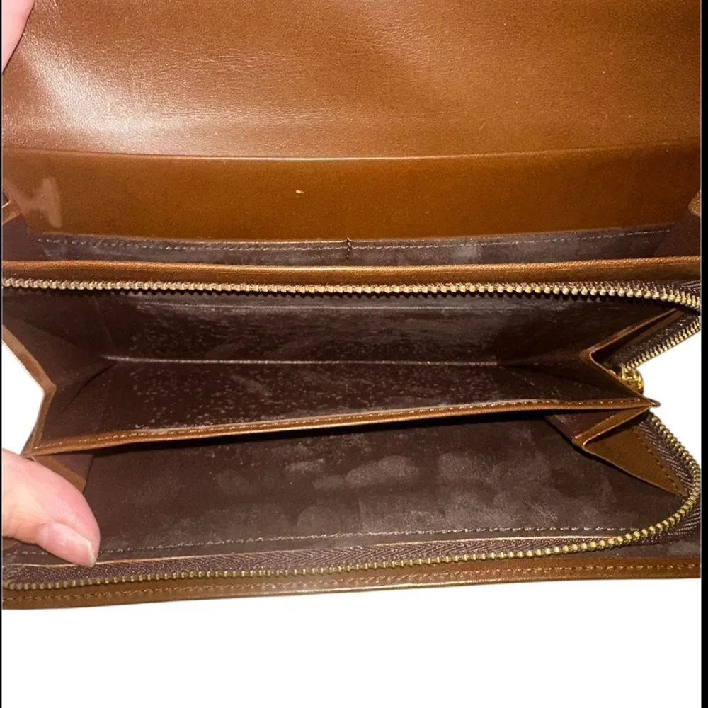Yves Saint Laurent Tan Leather Wallet with Gold Clasp with marks and scratches.